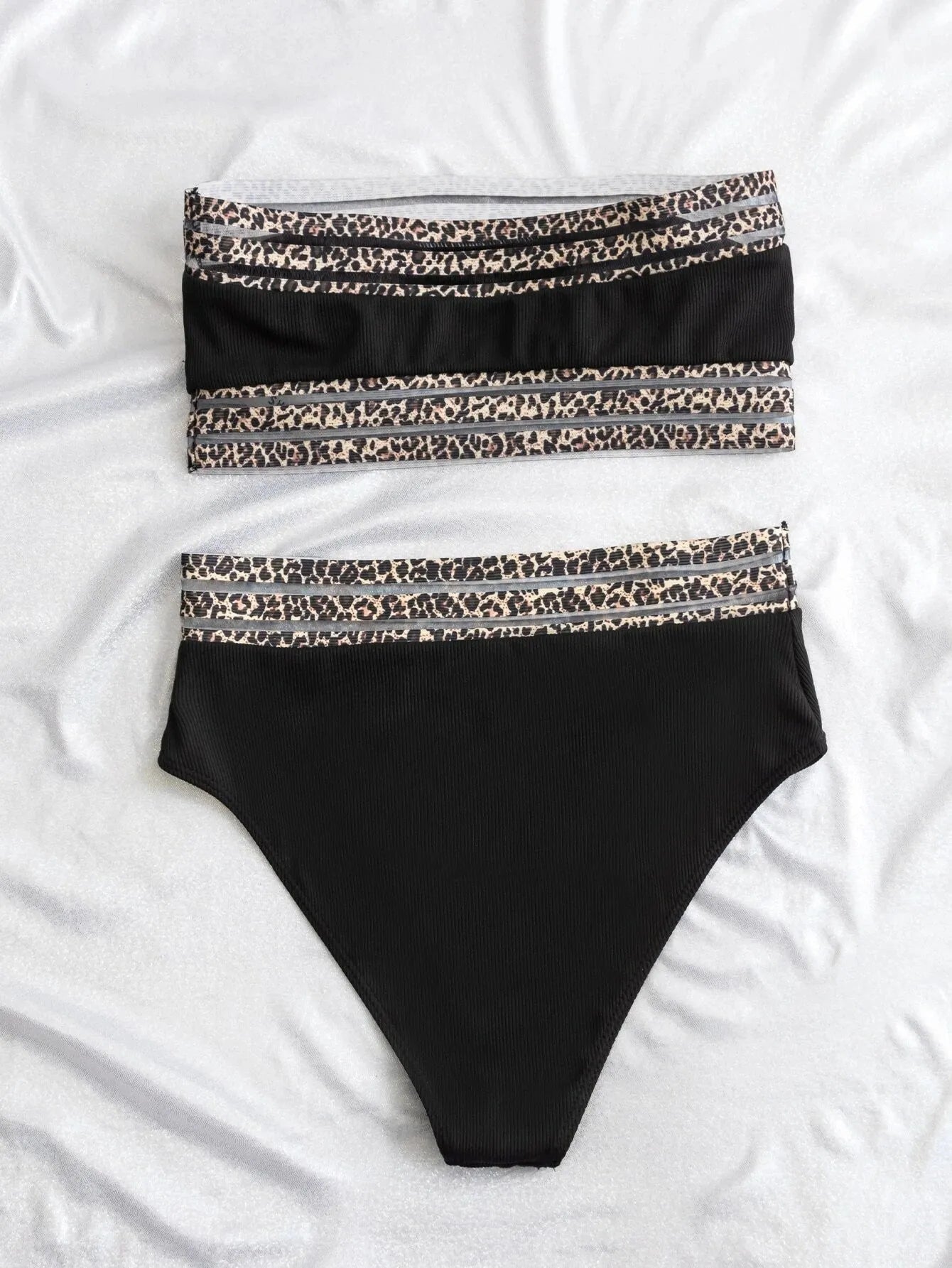 Black strapless bikini set with leopard pattern splicing detailing, showing bra and shorts pieces