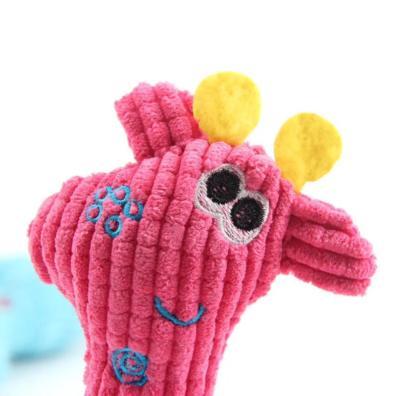 Blue deer-shaped plush dog toy with corn grain texture lying on a neutral background.