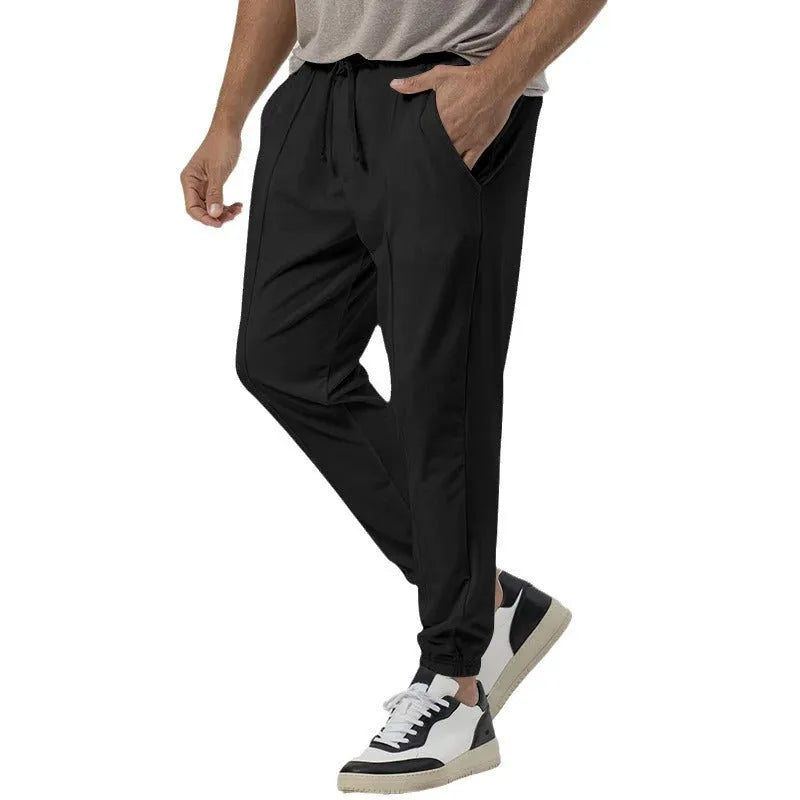 Men's grey cotton blend track sweatpants with straight-leg design and mid waist