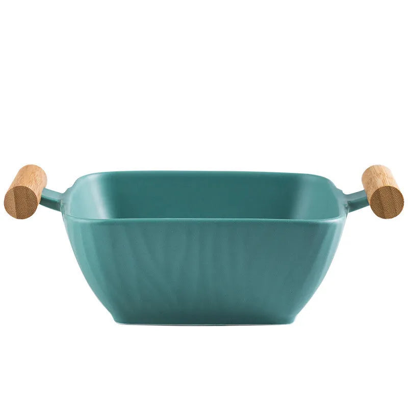 Porcelain ceramic bowl with irregular shape and matching lid in modern design