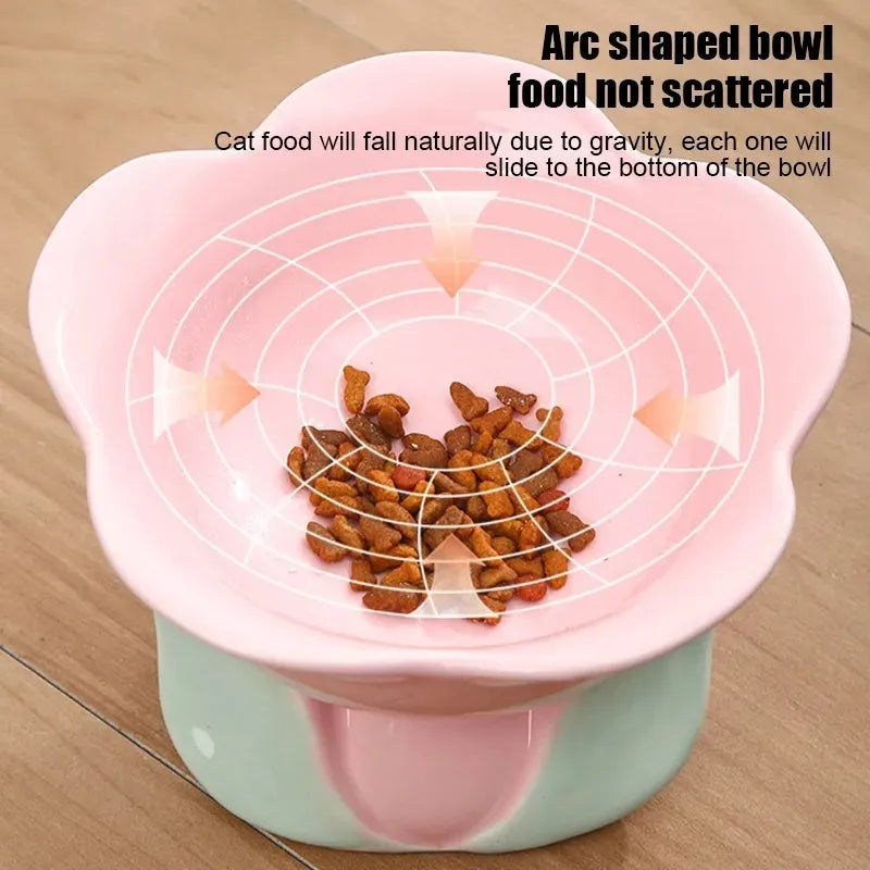 Blue floral patterned raised ceramic pet bowl for cats and dogs on a non-slip base.