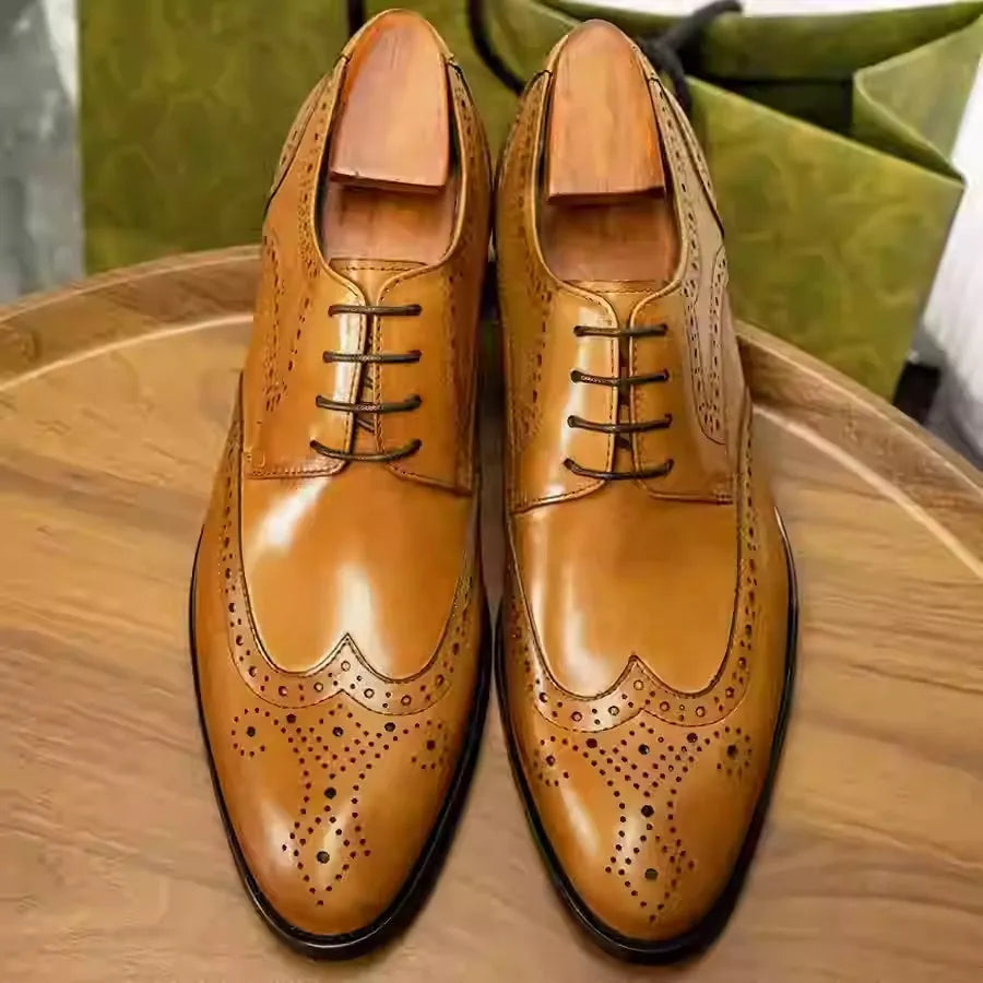 British-style men's formal pointed toe leather dress shoes with carved patterns in burgundy
