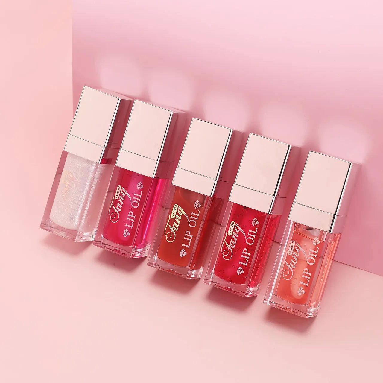 Five colour options of bright lip gloss mint lipstick with moisturising lip essence oil applicator