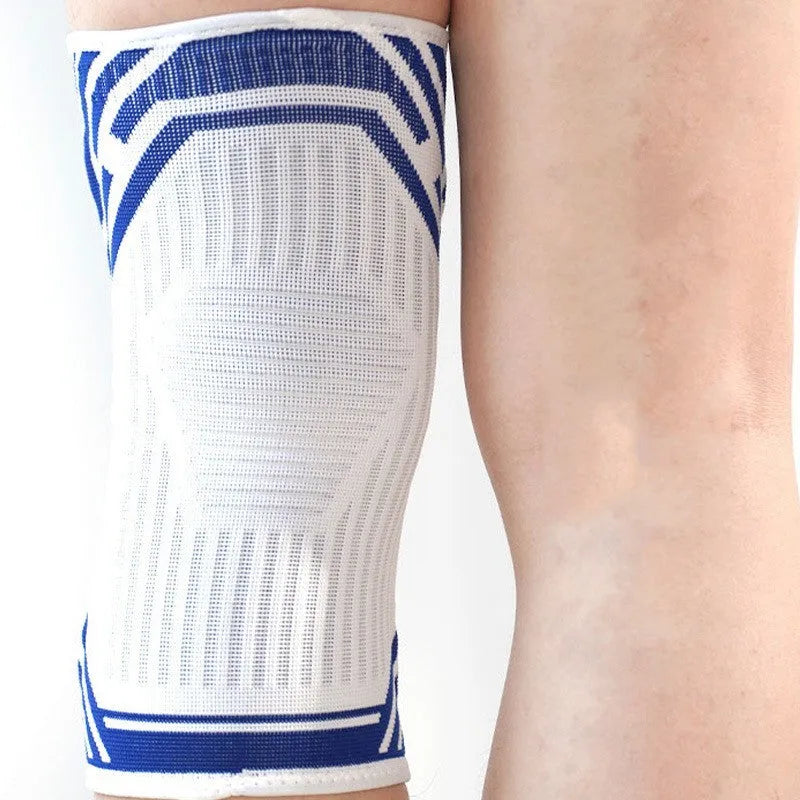 A blue cotton knee pad for adult sports like basketball and running, showing its elastic fit.