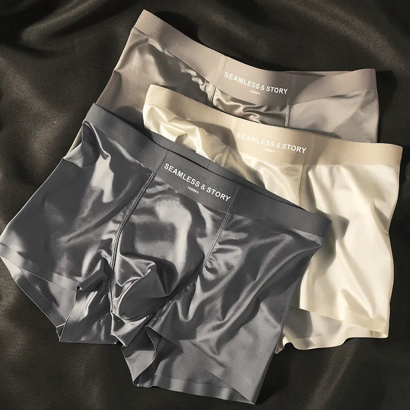 Men's ice silk satin boxer shorts on a white background, showing mid-waist design.