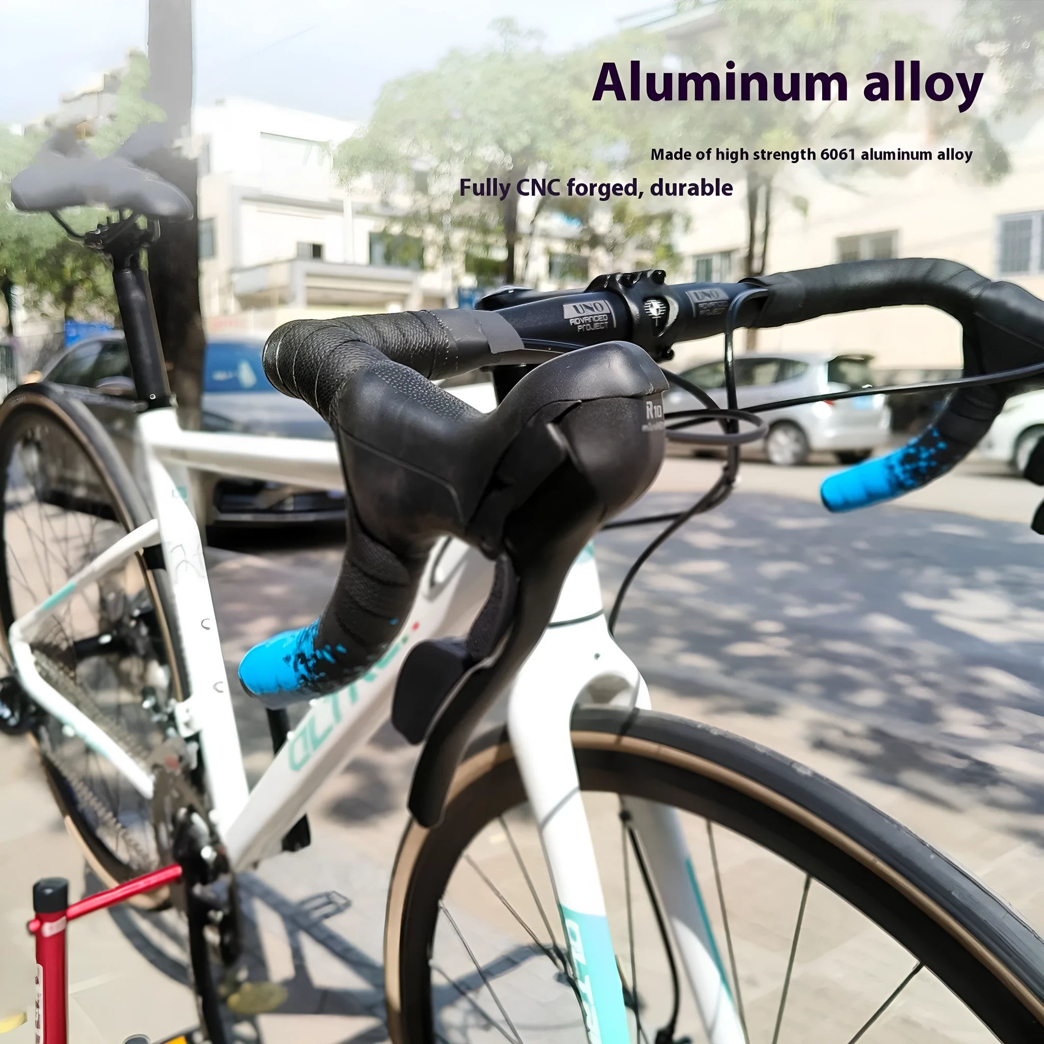 Black UNO aluminium alloy road bike drop handlebar showing bent shape and 31.8mm clamp area