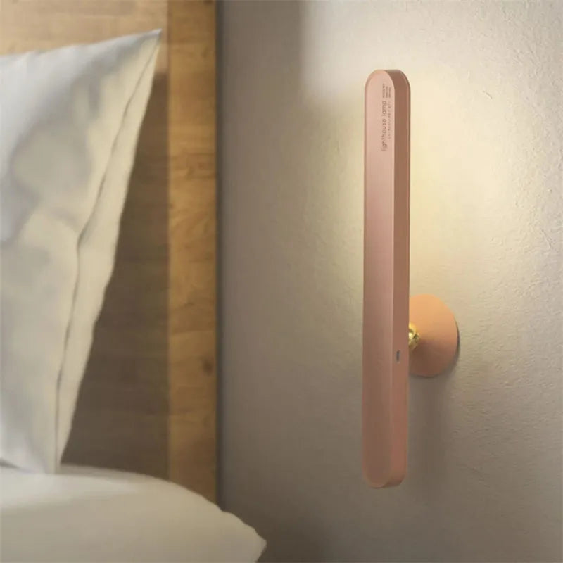 Geometric desk lamp with magnetic base shown attached to metal surface as wall light