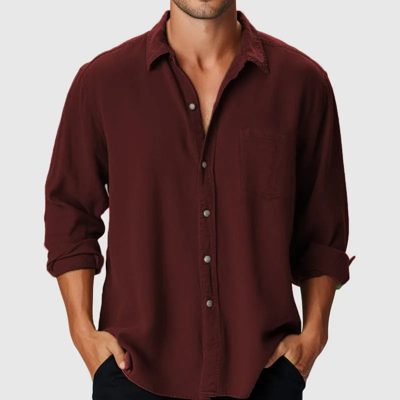 Man wearing a loose-fit, long-sleeve polyester beach shirt with a stand collar
