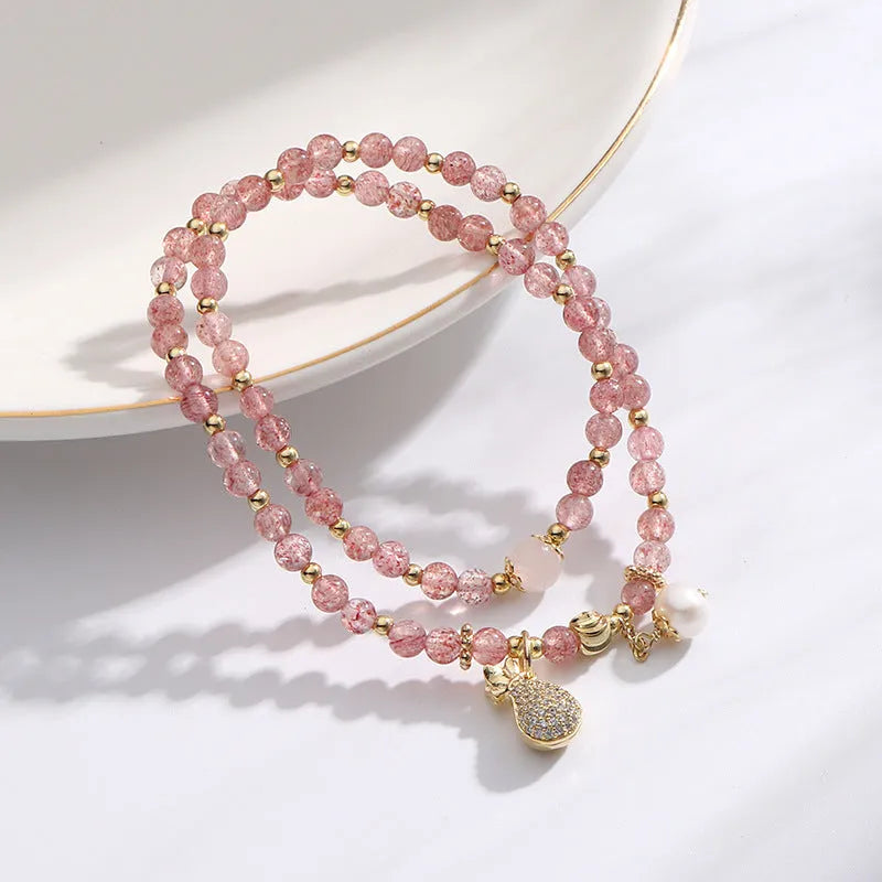 Women's strawberry quartz crystal bracelet with geometric design for money drawing and luck changing
