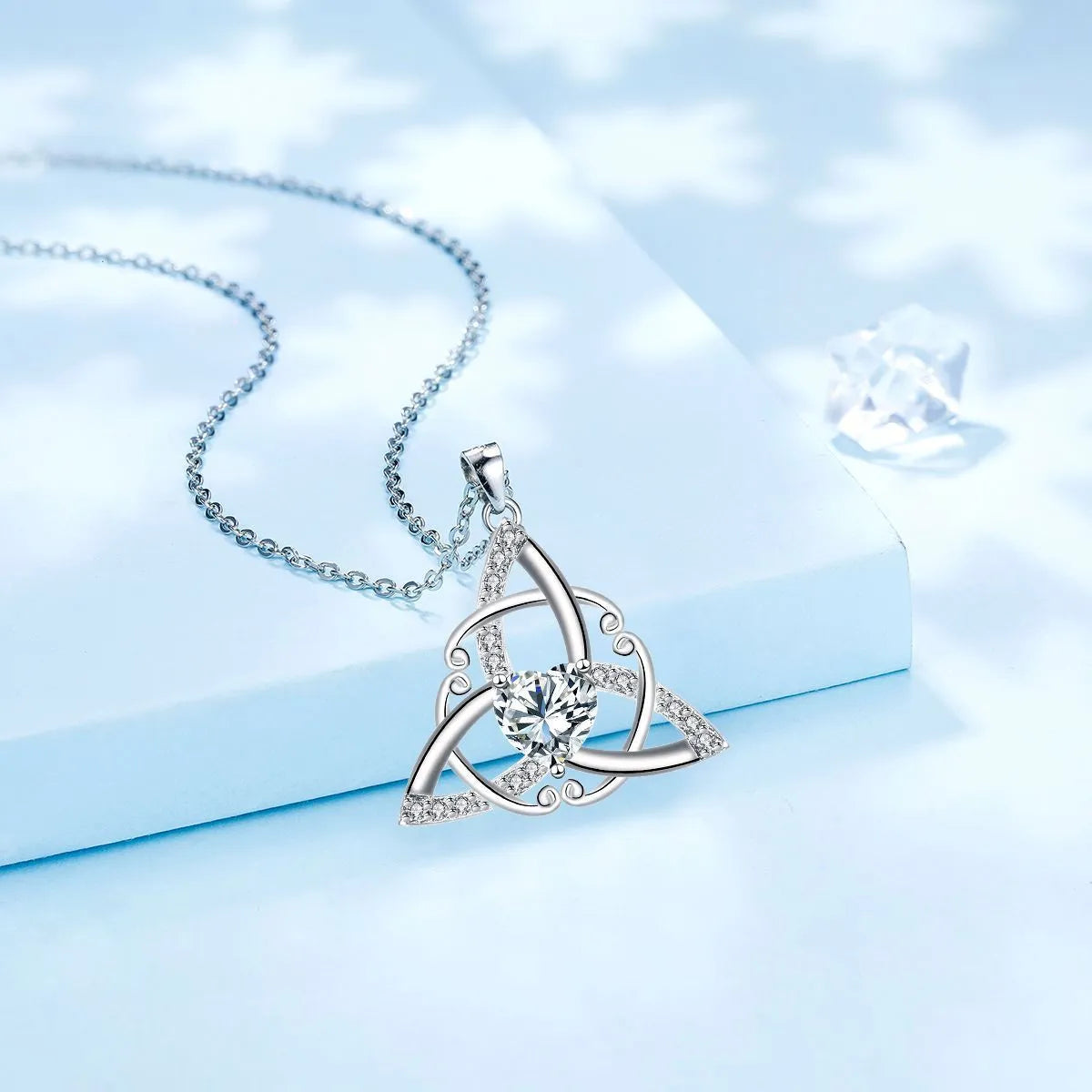 Copper Celtic knot pendant necklace in choice of electroplated colours: white, blue, green, or red.