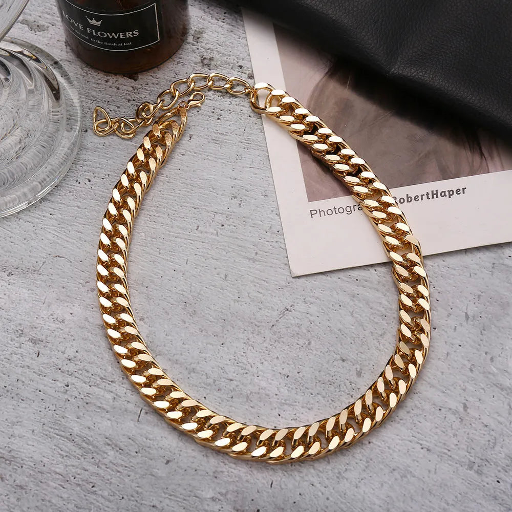 Women's gold electroplated thick chain necklace showing 32cm length and alloy construction