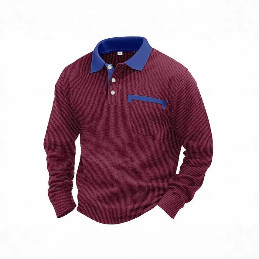 Man modelling a loose-fit long-sleeved waffle-knit polo shirt in a solid colour with an asymmetrical style detail.
