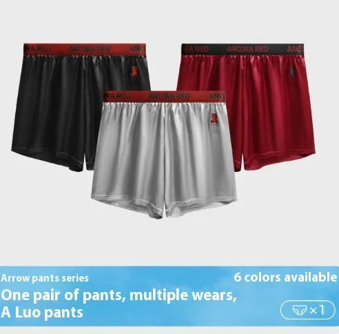 Solid colour men's boxer briefs on a mid-waist model, showing polyester knit fabric in black, blue, red, silver, purple and brown.
