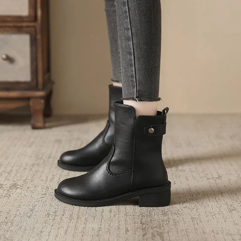 Black women's ankle boots with side zip and a low round toe.