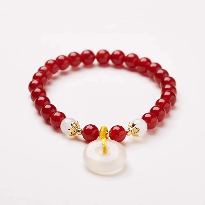 Natural jinsi jade bracelet with peace clasp showing agate and strawberry quartz beads