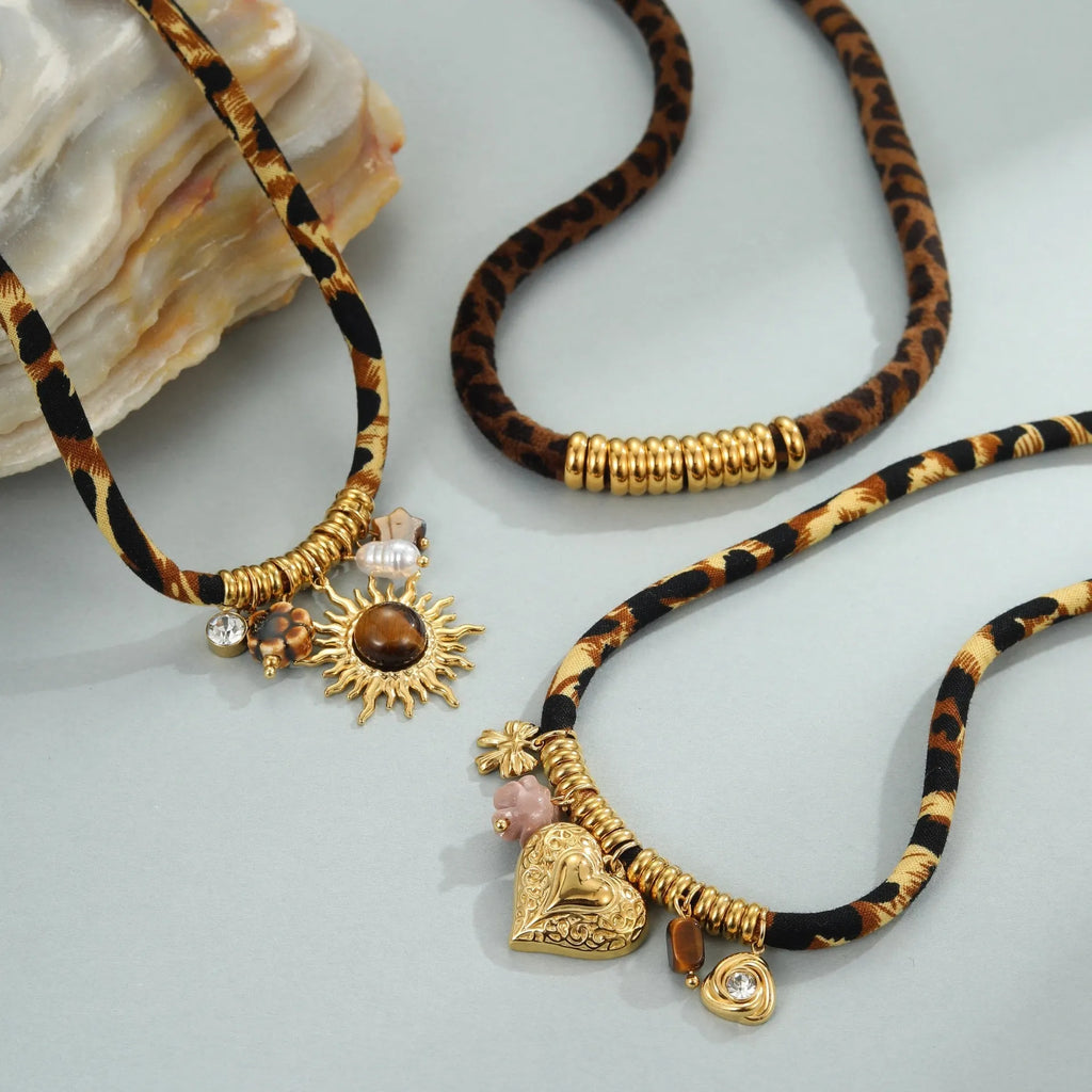 Geometric leopard pendant necklace with gold electroplated finish on adjustable stainless steel chain