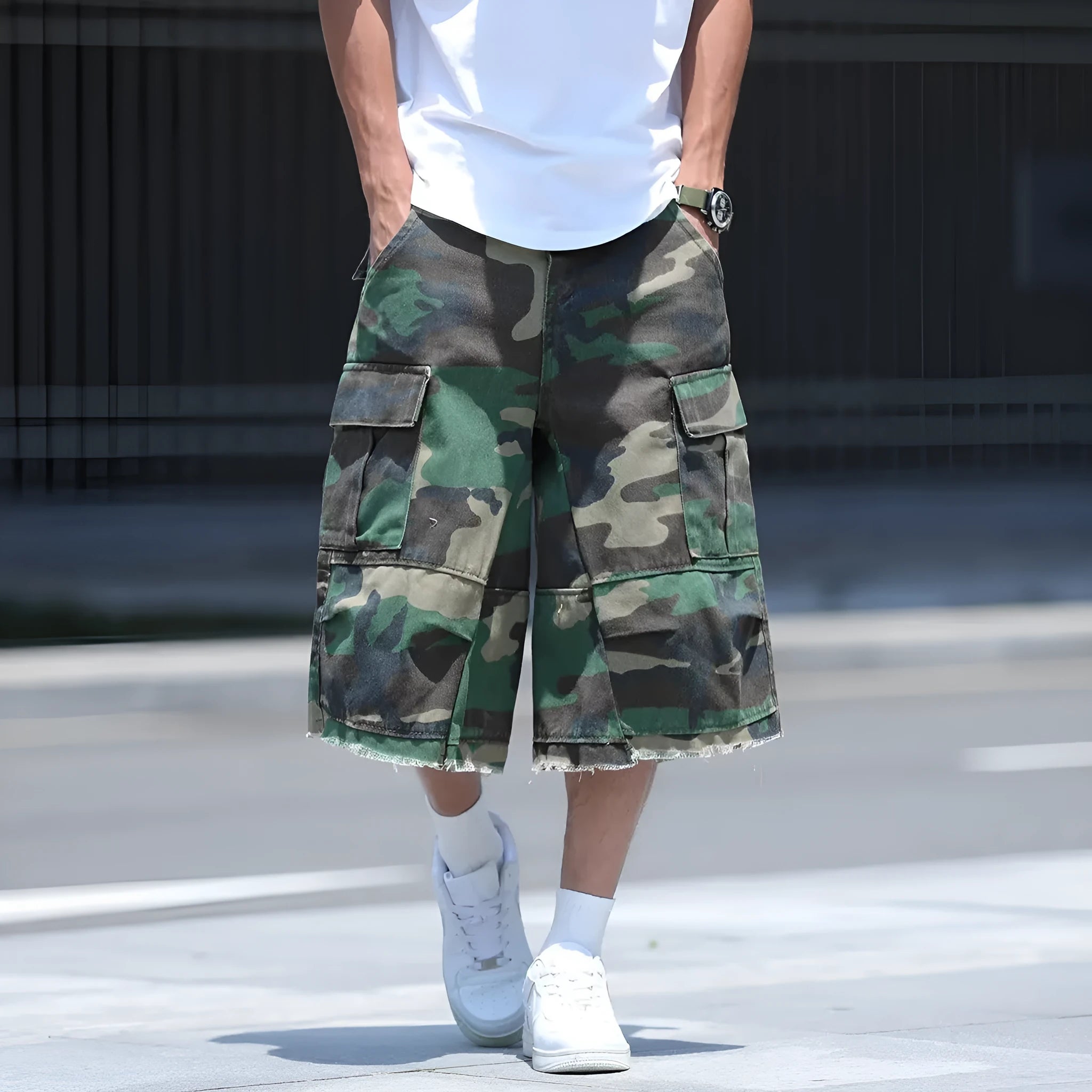 Men's loose-fit camouflage print shorts in retro workwear style on a white background.