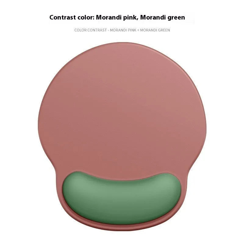 Silicone mouse mat with attached gel wrist support in a gradient blue colour on a desk.