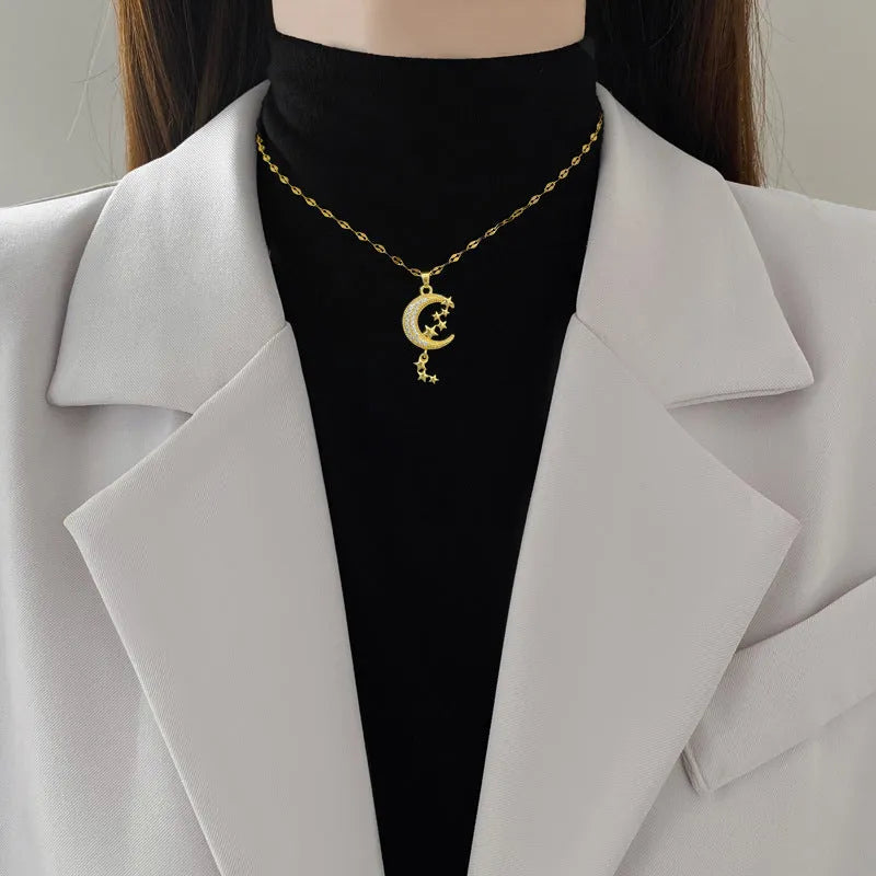 Moon tassel necklace with diamond elements on stainless steel chain and copper pendant