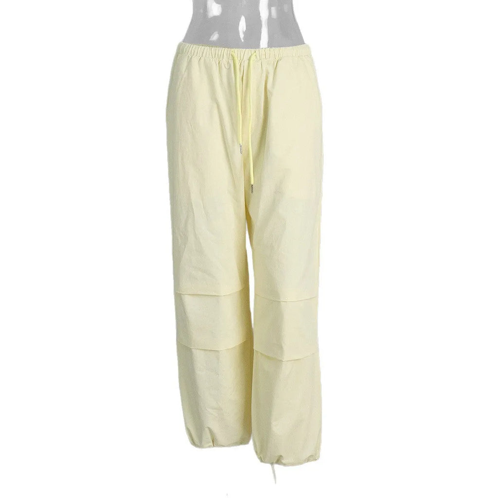 Women's polyester drawstring loose casual trousers in solid yellow colour on model