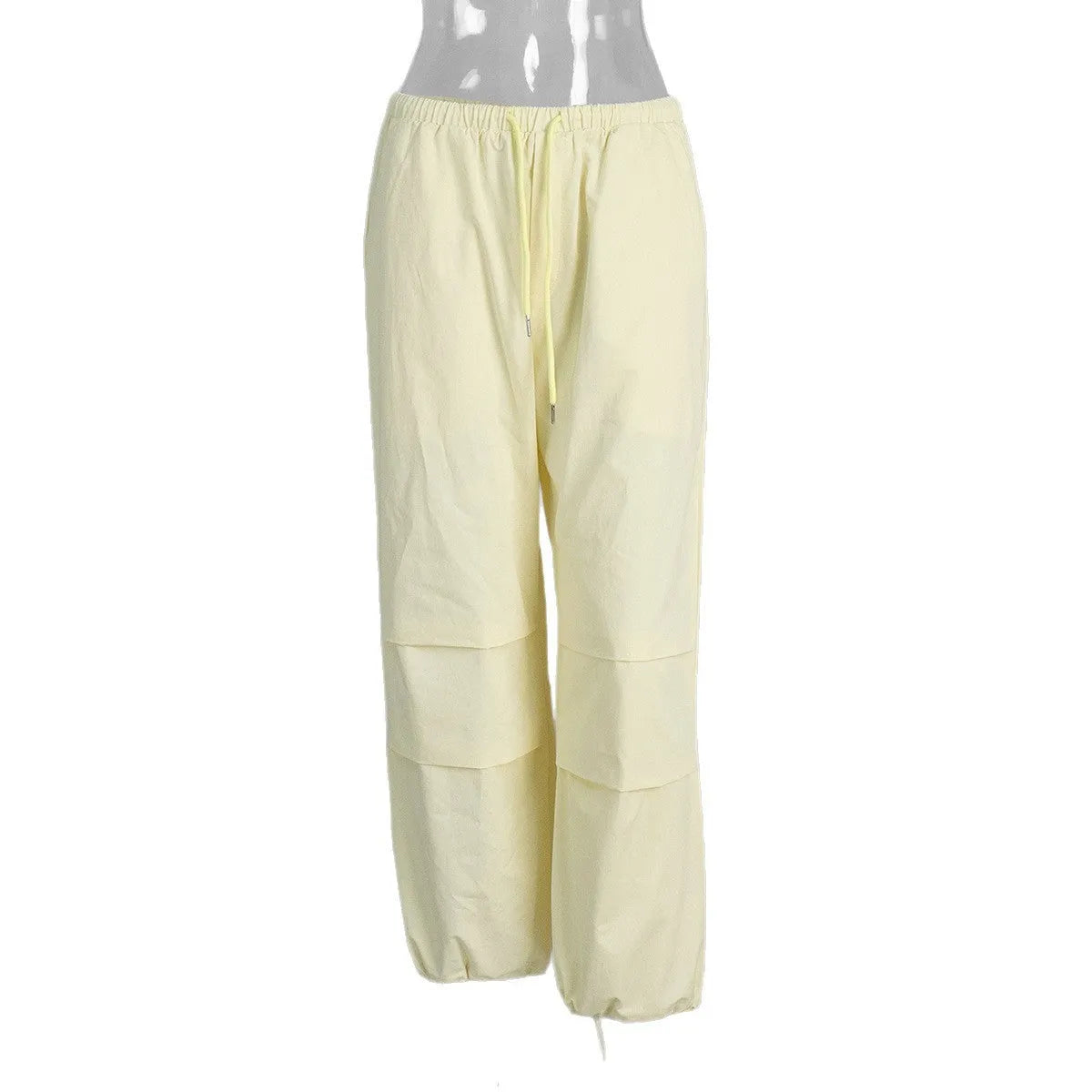 Women's polyester drawstring loose casual trousers in solid yellow colour on model