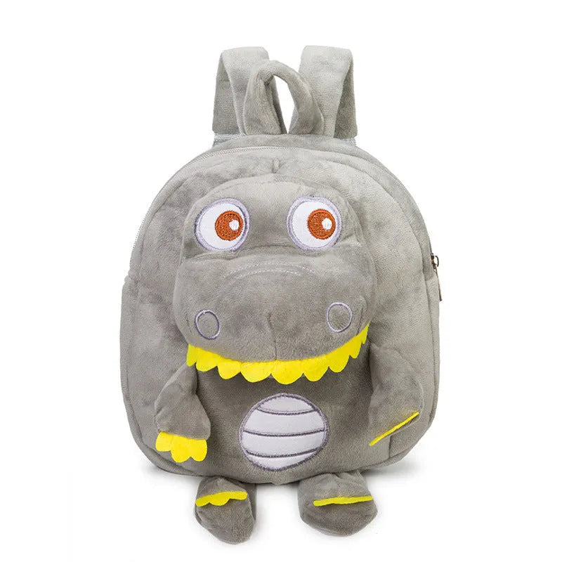 Blue baby dinosaur plush backpack with embroidered detail and a soft handle.