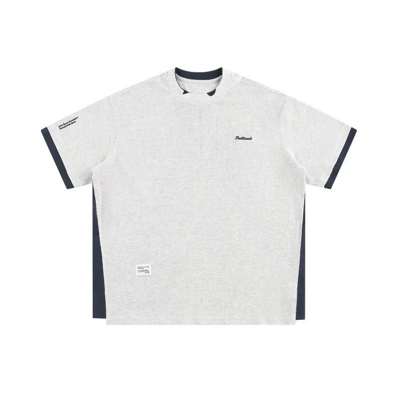 Retro alphabet embroidered loose waffle short-sleeved t-shirt in navy blue, front view.