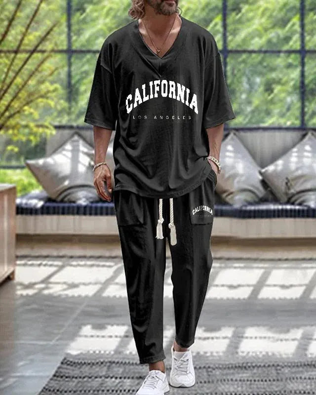 Polyester cropped sleeve V-neck jacket and trousers suit set on a hanger.