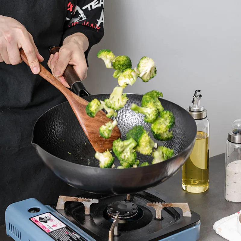 Traditional black iron wok with wooden handle showing 40cm diameter and flat induction base