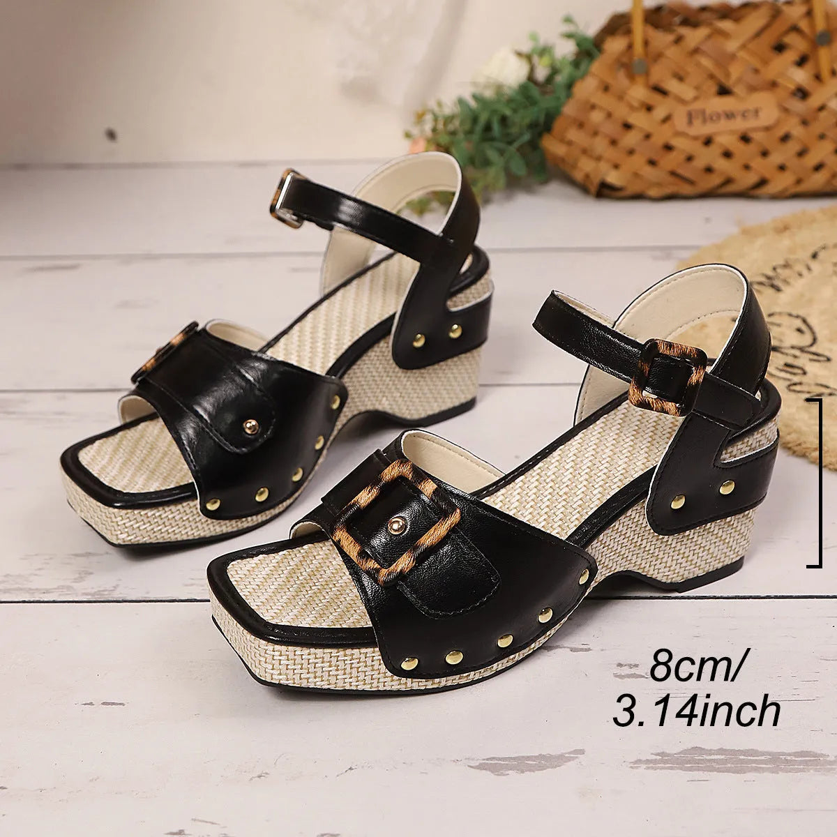 Women's black chunky heel sandals with a large square metal buckle over the instep.
