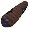 Outdoor cotton sleeping bag in army green with its compression storage bag laid alongside.