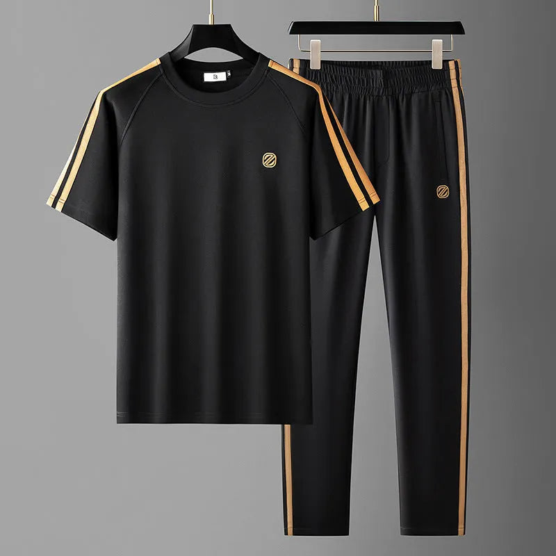 Men's blue ice silk style polyester sportswear set with short sleeve top and matching trousers