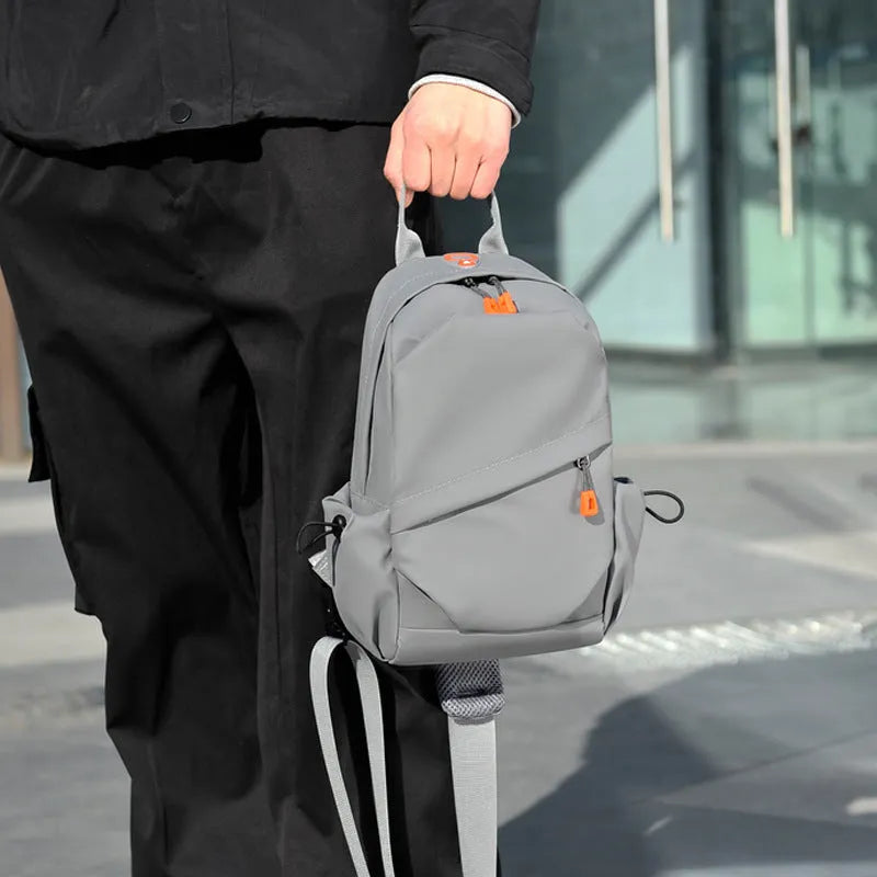 Men's black polyester crossbody bag with adjustable strap and simple casual styling