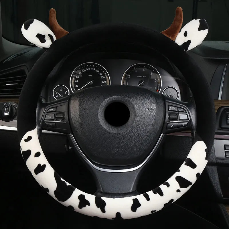 Black short plush car steering wheel cover shown on a vehicle steering wheel