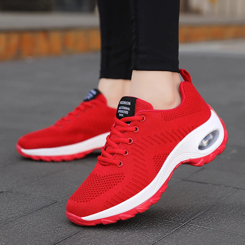 Red and black women's mesh sneakers with front lace-up and round toe on flat PU sole