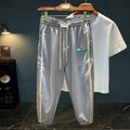 Men's black harem pants with mid-waist fit and trousers length made from ice silk cotton blend fabric