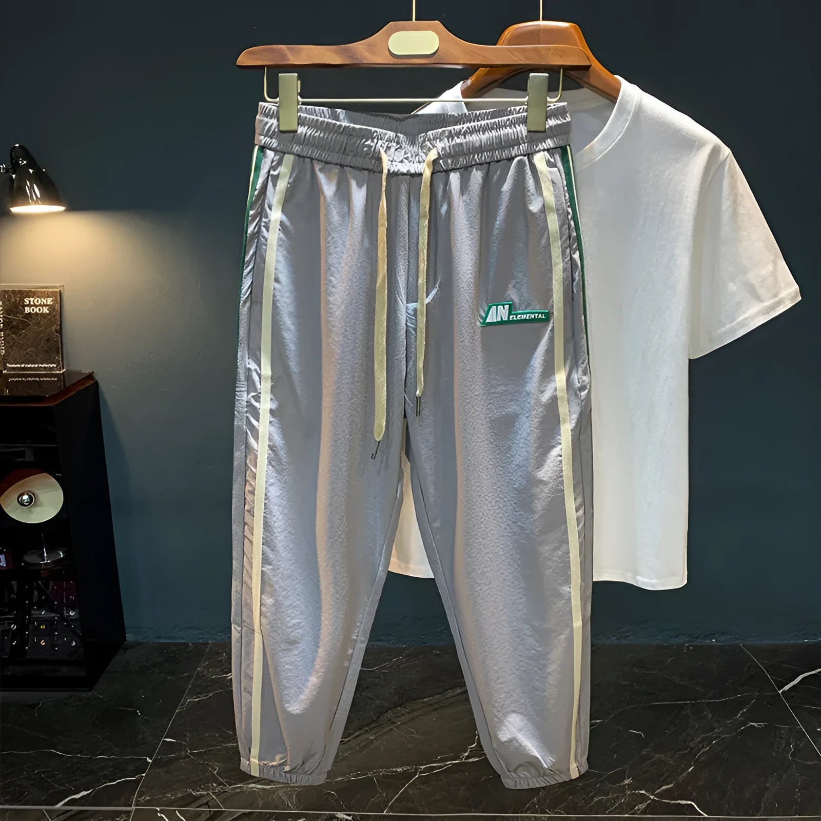 Men's black harem pants with mid-waist fit and trousers length made from ice silk cotton blend fabric