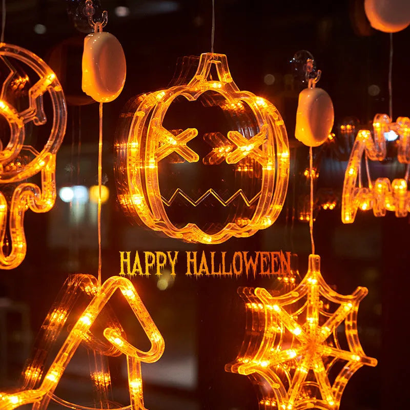 Set of seven battery-powered Halloween LED hanging lights with ghost, spider, and pumpkin designs for window decoration.