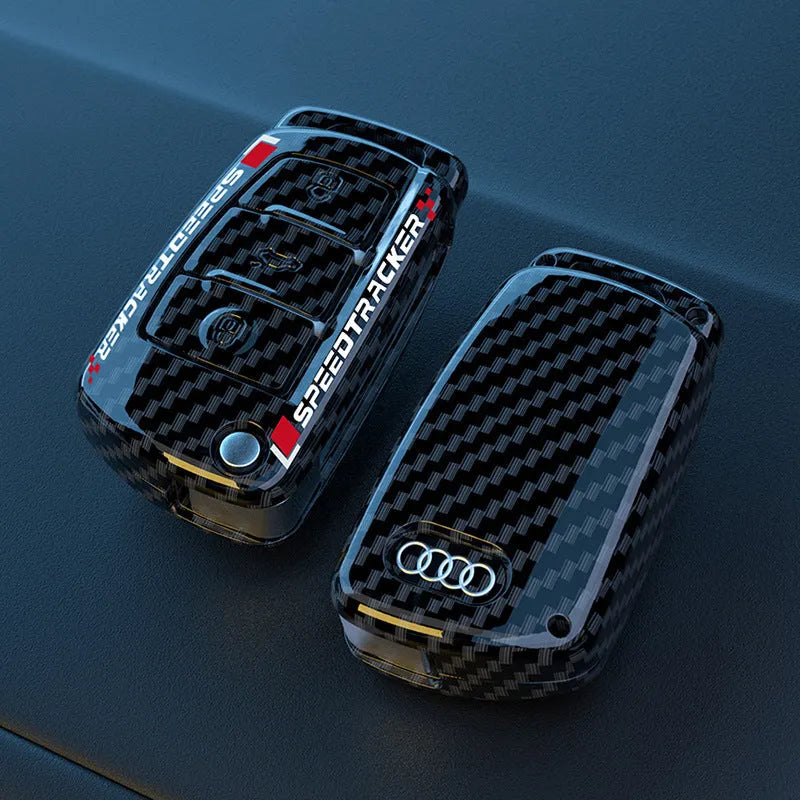 Carbon fibre style car key cover with mirror in feilin material, shown in carbon colour.