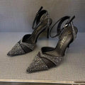 Women's silver and black stiletto heels with red sole and hollow design, pointed toe formal shoes