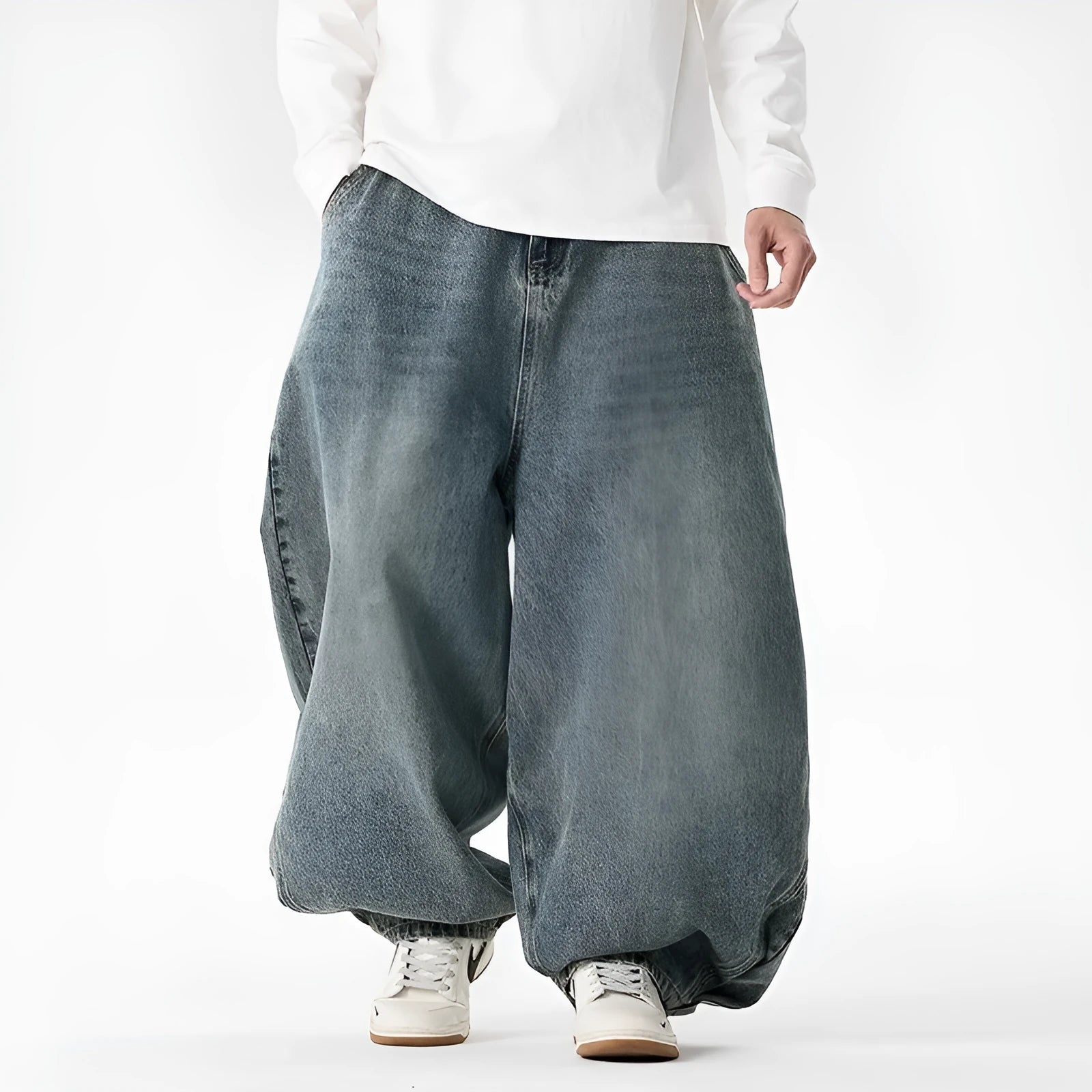 Men's plus-size baggy jeans in light blue denim with straight legs and low waist.