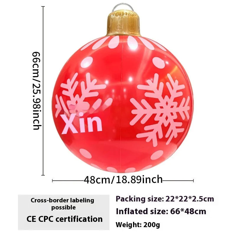 Large inflatable Christmas ball decoration with LED lights in garden setting