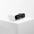 White wireless charger Bluetooth speaker with night light showing charging surface and control buttons