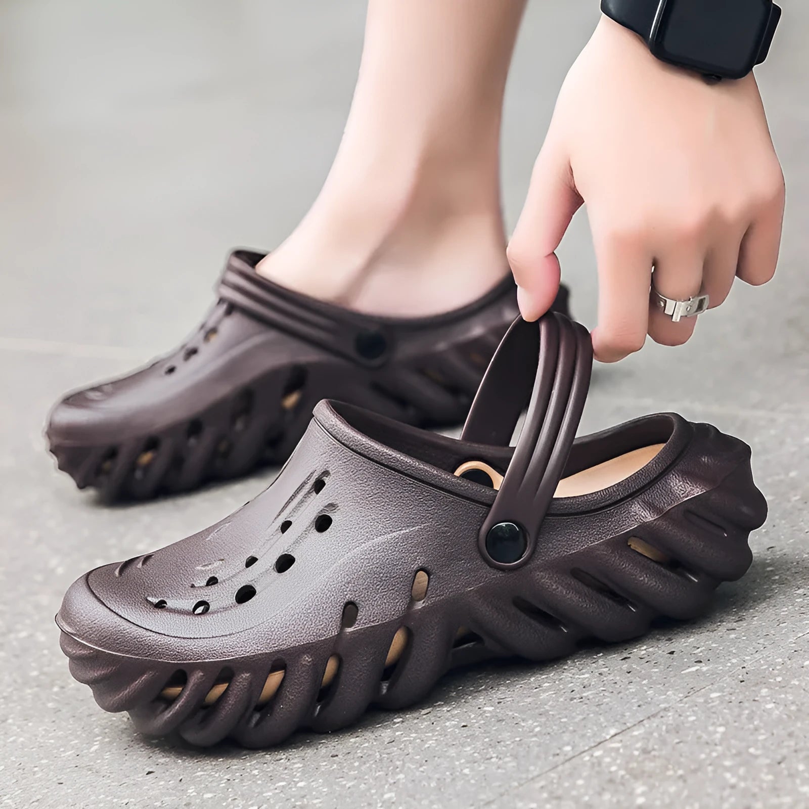 Men's beige hollow-out EVA slipper sandals with non-slip sole and round toe, shown on a white background.