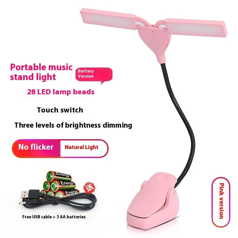 Black rechargeable music stand lamp with 28 LED lights and USB cable on a music stand.