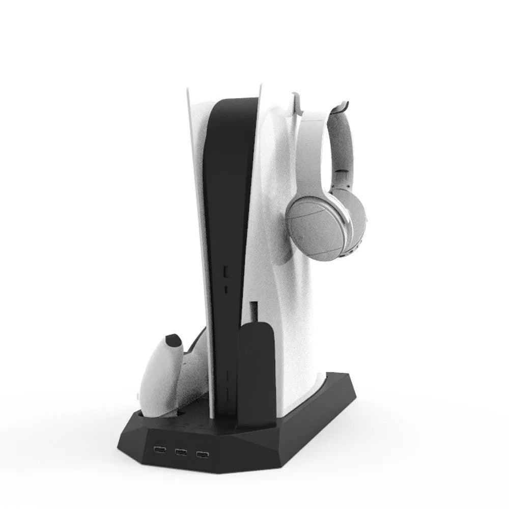 White PS5 charging dock and cooling base station with controllers and headset on display