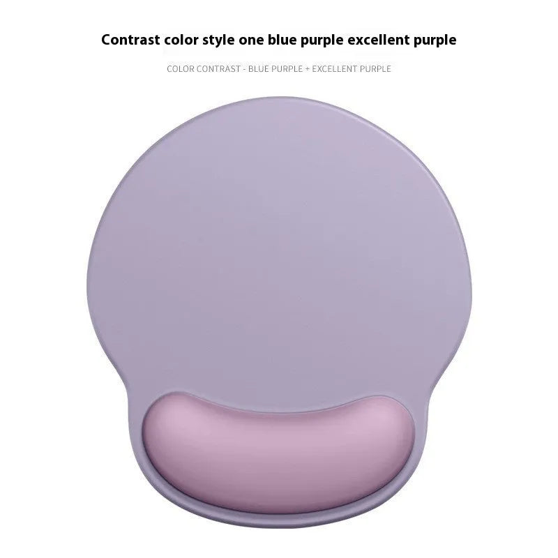 Silicone mouse mat with attached gel wrist support in a gradient blue colour on a desk.
