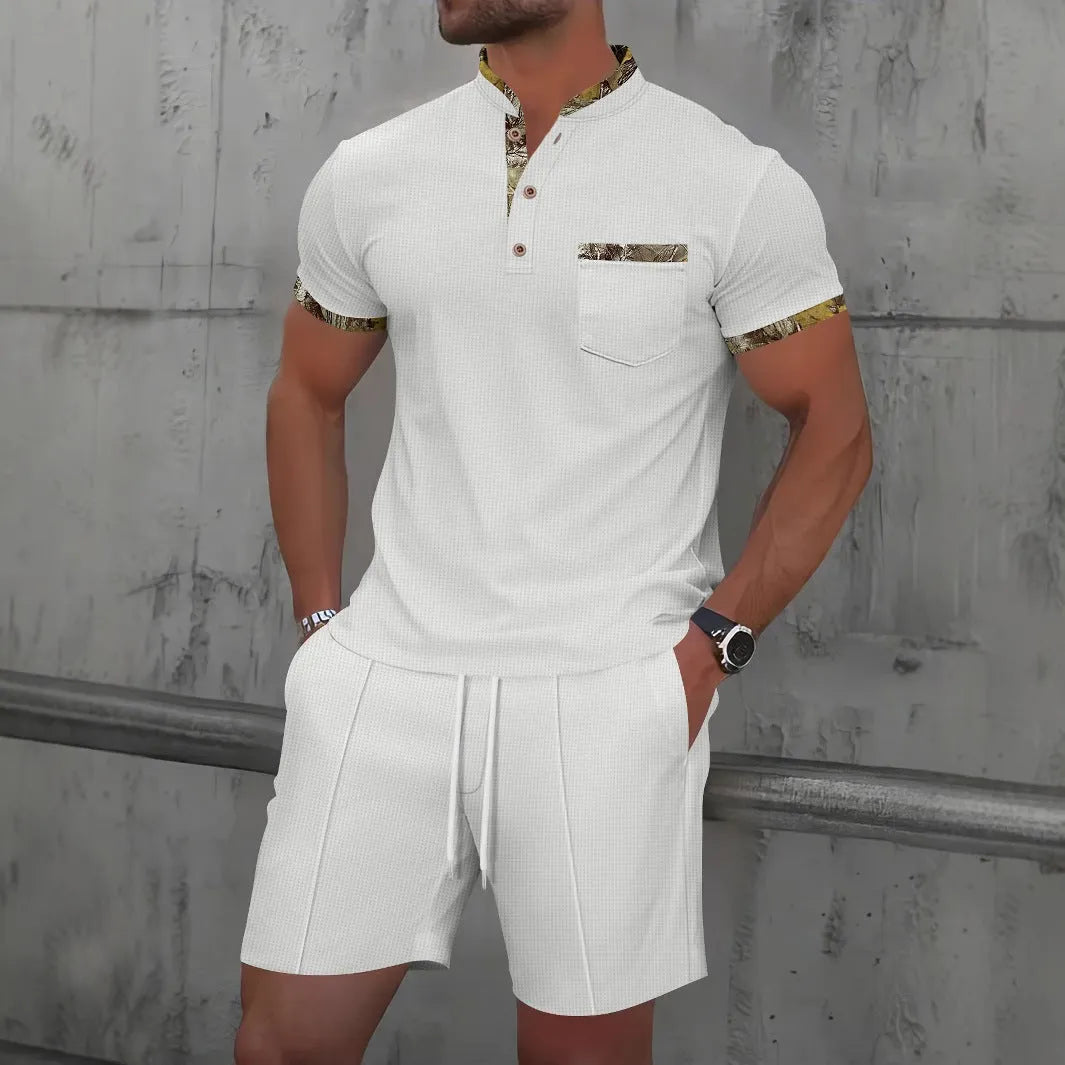 Man wearing a grey waffle knit zip-up polo collar tracksuit with matching shorts for summer leisure.