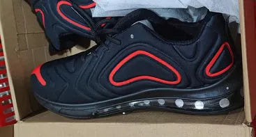 Men's black casual sneakers with lace-up front, thick sole, and round toe design