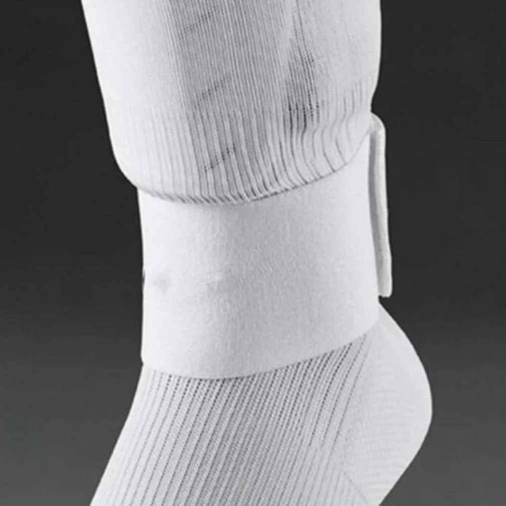 Red rubber elastic strap for securing football shin guards, shown flat measuring 25cm long.